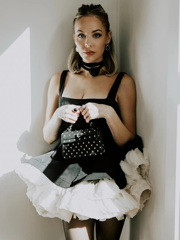 Elegant Black Mini Dress with Peplum and White Ruffle Accents for Upscale Casual Gatherings