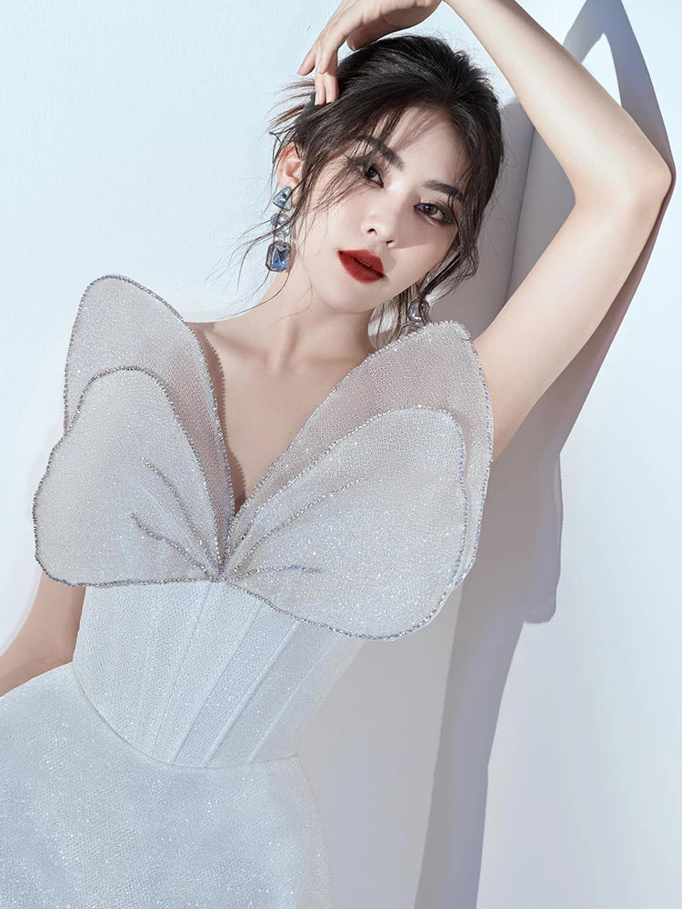 Glamorous White Strapless Mini Dress with Sparkling Butterfly Detailing for a Gala Event