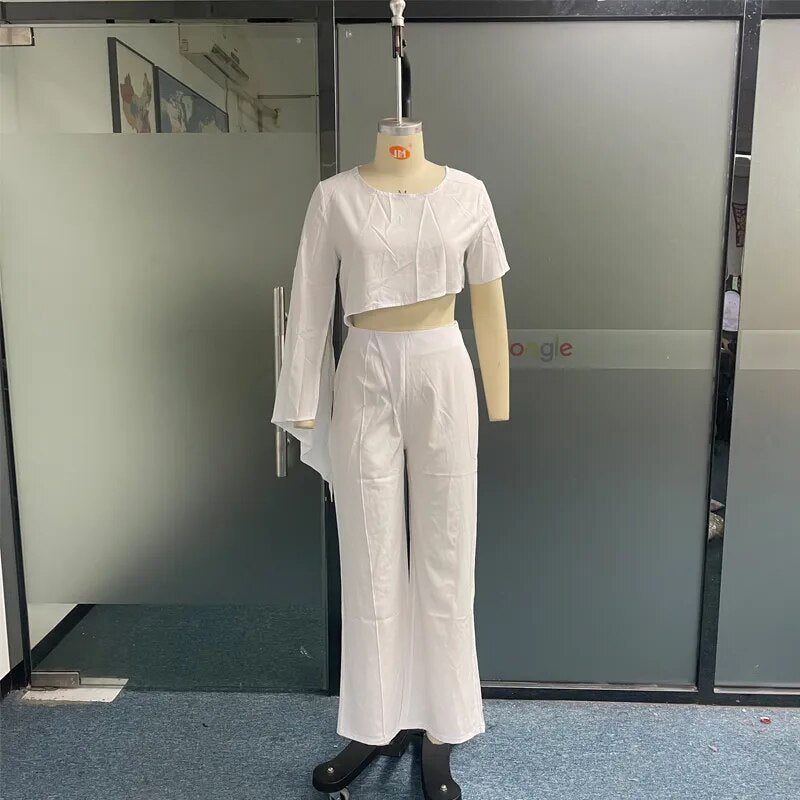 女性ツーピースセット秋のファッション O ネックハイとロー非対称スリーブトップロングパンツセット固体ハイストリート