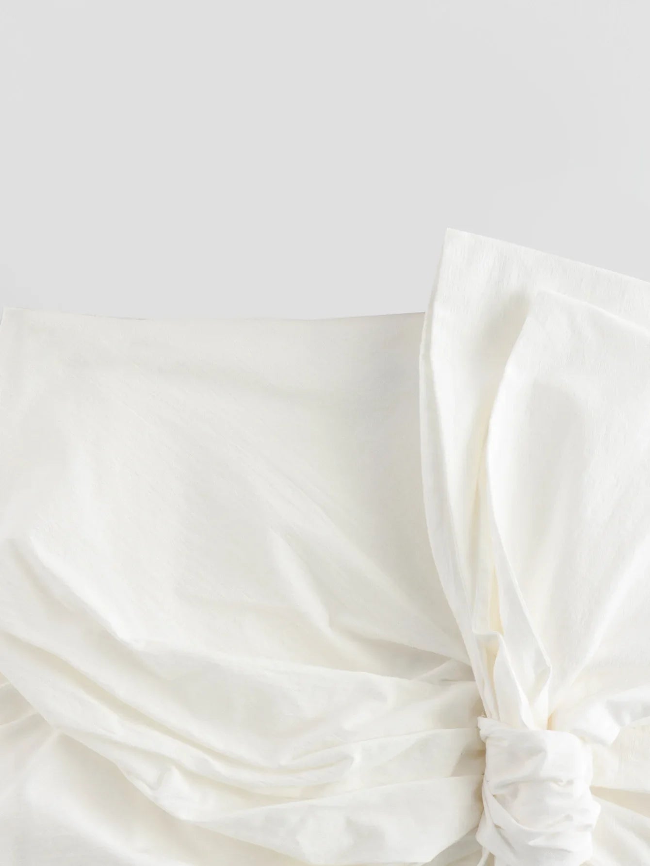 TRAFZA Elegant Woman Solid Back Zipper High Waist Short Skirts Women Summer Chic Asymmetric Bow Lace-Up Decorate Mini Skirt Y2K