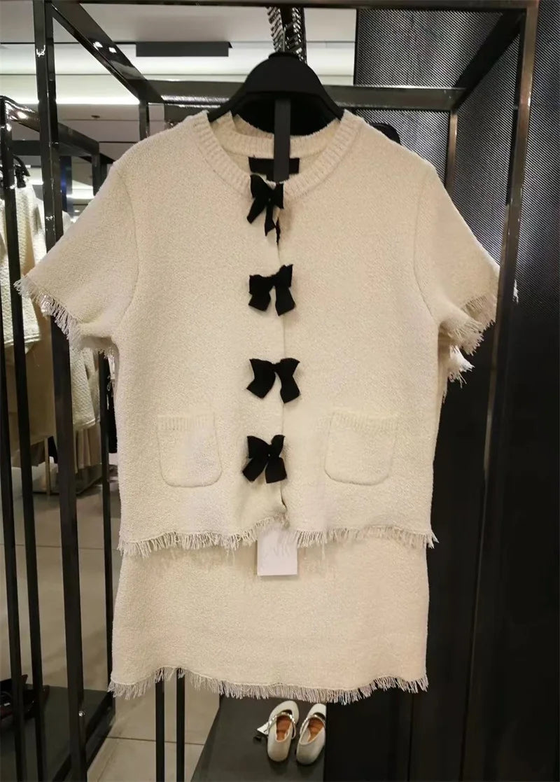 Women's suit New Spring 2025 Black bow trim White knitted long-sleeved jacket Mini skirt Celebrity style Elegant