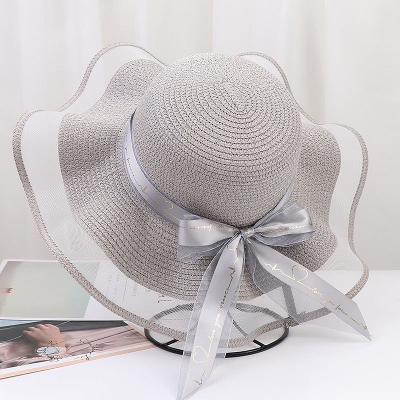 2024 New Korean Style Woman Straw Hat Bow Ribbon Large Brim Sunshade Ins Outing Fashion Beach Holiday ladies sun Hat Gray 57 cm