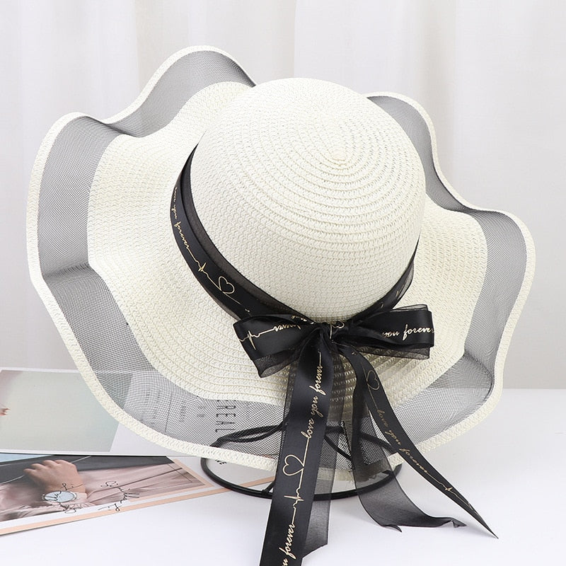 2024 New Korean Style Woman Straw Hat Bow Ribbon Large Brim Sunshade Ins Outing Fashion Beach Holiday ladies sun Hat Ivory 57 cm