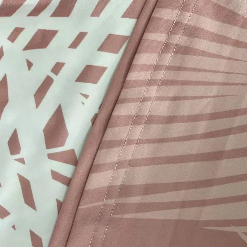 Plus size women's fashion casual vacation short sleeve set with printed top and solid color bottom.