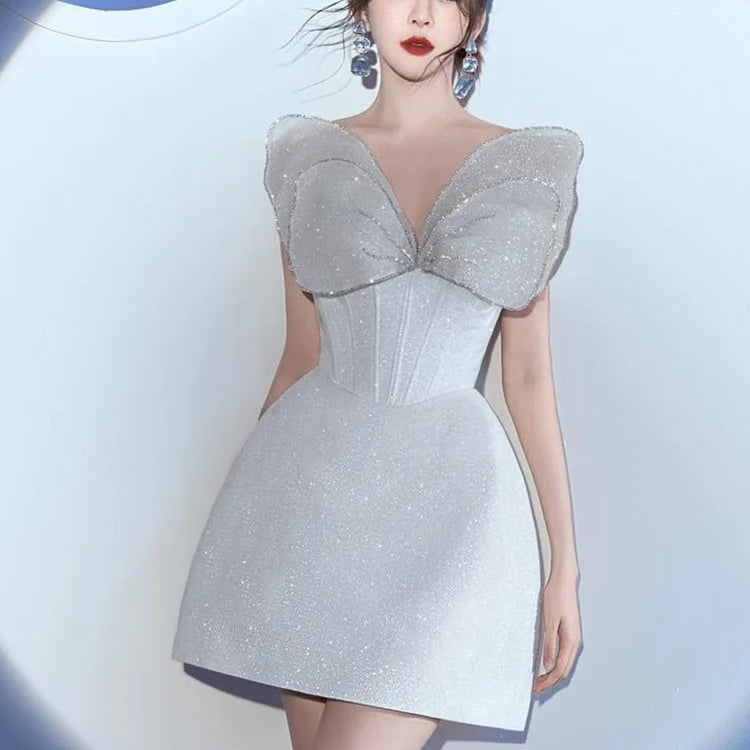 VC Glamorous White Strapless Mini Dress with Sparkling Butterfly Detailing for a Gala Event