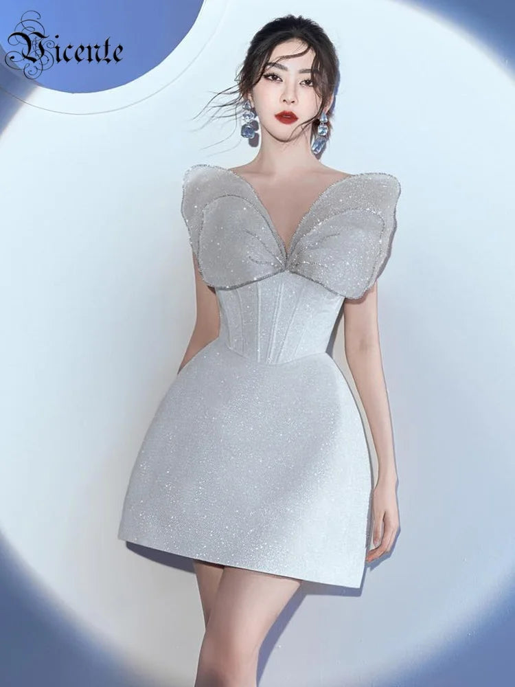 Glamorous White Strapless Mini Dress with Sparkling Butterfly Detailing for a Gala Event