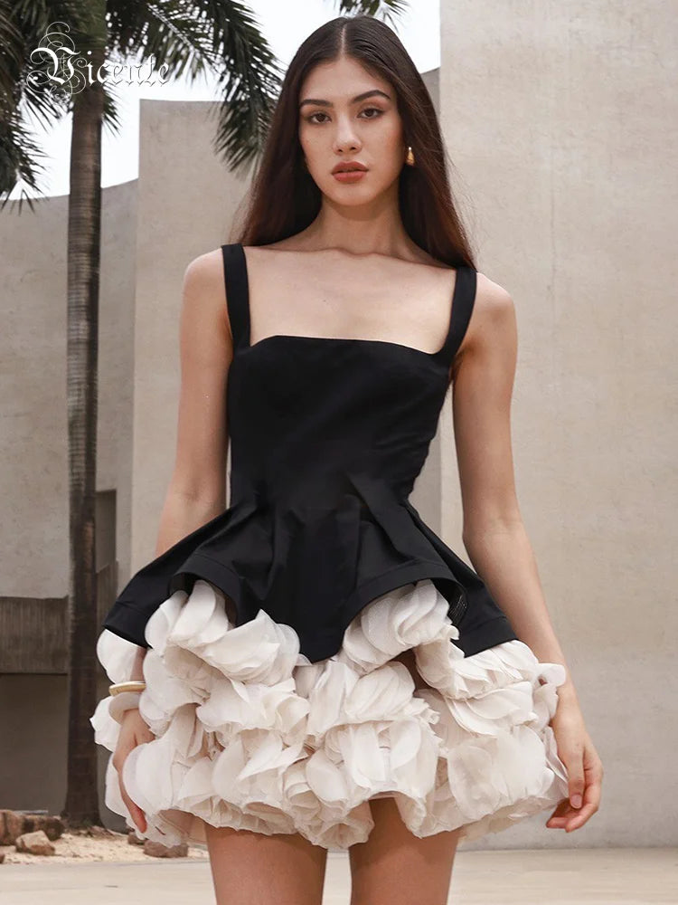 Elegant Black Mini Dress with Peplum and White Ruffle Accents for Upscale Casual Gatherings